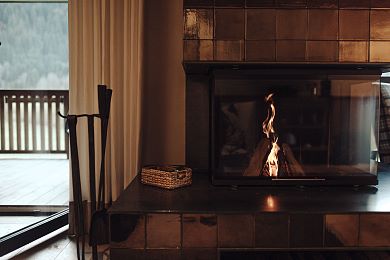 The open fireplace provides warmth and comfort
